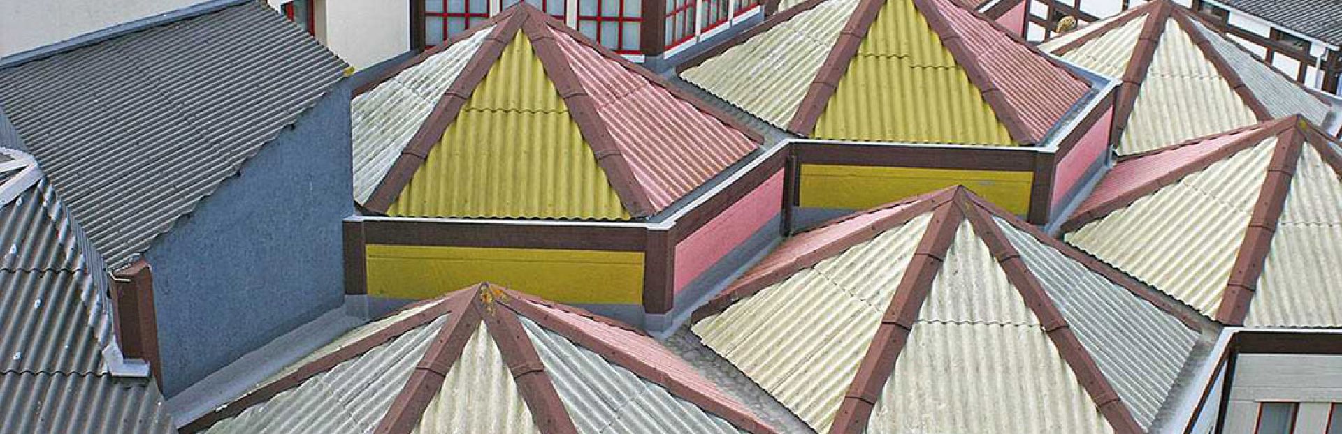Model of a building with colorful roof designs